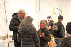 Kaaren Soby, foreground right, chats with attendees at an exhibition reception at the Smithers Art Gallery in 2019. (Thom Barker/The Interior News)