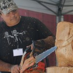 Robert Bideshi carves an owl in wood using a chainsaw during the 153rd annual Chilliwack Fair at Chilliwack Heritage Park on Saturday, Aug. 9, 2025.
