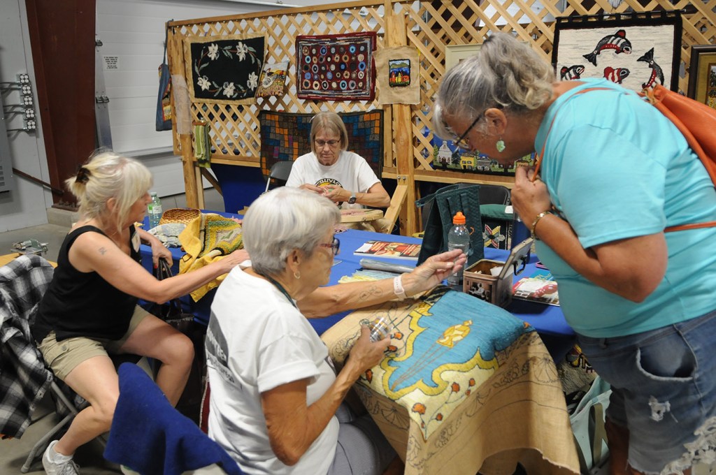 Rug hookers work on pieces during the 153rd annual Chilliwack Fair at Chilliwack Heritage Park on Saturday, Aug. 9, 2025.