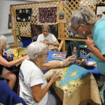 Rug hookers work on pieces during the 153rd annual Chilliwack Fair at Chilliwack Heritage Park on Saturday, Aug. 9, 2025.