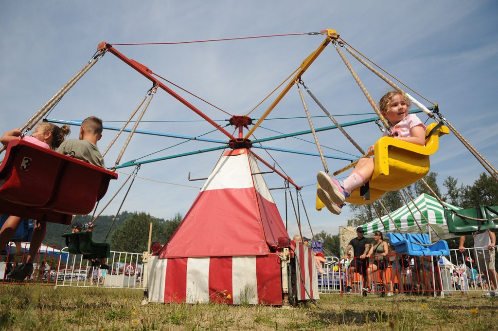 Kids go around on a ride during the 153rd annual Chilliwack Fair at Chilliwack Heritage Park on Saturday, Aug. 9, 2025.