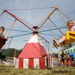 Kids go around on a ride during the 153rd annual Chilliwack Fair at Chilliwack Heritage Park on Saturday, Aug. 9, 2025.
