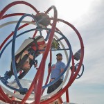 Ben Gunn spins eight-year-old Carter VanDer Kooi around on the Space Ball during the 153rd annual Chilliwack Fair at Chilliwack Heritage Park on Saturday, Aug. 9, 2025.