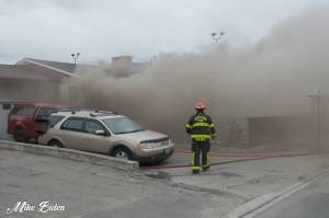 Penticton fire crews responded to a house fire on Duncan Avenue and Main Street Saturday night. (Photo: Mike Biden)
