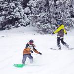 Snowboarders make their way down the hill on the opening day of Hudson Bay Mountain Resort for 2019. (Trevor Hewitt/Black Press Media file photo)
