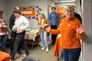 Josie Osborne, right, NDP MLA-elect for a second term, thanks her campaign team after the results of the 2024 B.C. provincial election are announced.