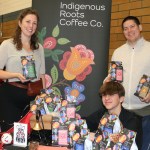 Co-founders of Indigenous Roots Coffee Company Natasha Parrish (Sk'ing lúudas) and Kear Porttris, with nephew Joshua Josok, showcase products at the Oaklands West Coast winter market.