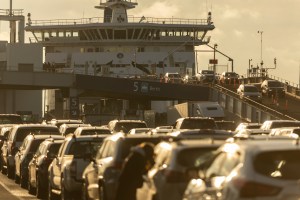 Vehicles drive off the ferry at Tsawwassen, where hundreds more vehicles wait to get onto a full BC Ferries sailing from Tsawwassen to Swartz Bay.
