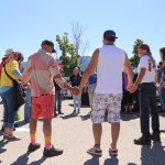 Protesters formed a prayer circle in the Vernon Walmart parking lot before forming a convoy to Edgewood's Universal Ostrich farm to protest a cull of nearly 400 ostriches Friday, May 30, 2025.