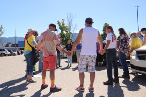 Protesters formed a prayer circle in the Vernon Walmart parking lot before forming a convoy to Edgewood's Universal Ostrich farm to protest a cull of nearly 400 ostriches Friday, May 30, 2025.