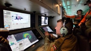 Crew members work to rescue a mariner 300 kilometres off the coast of Oregon.