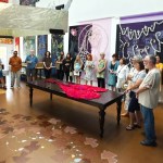 Artists gather for a meeting about their work being featured in Europe.