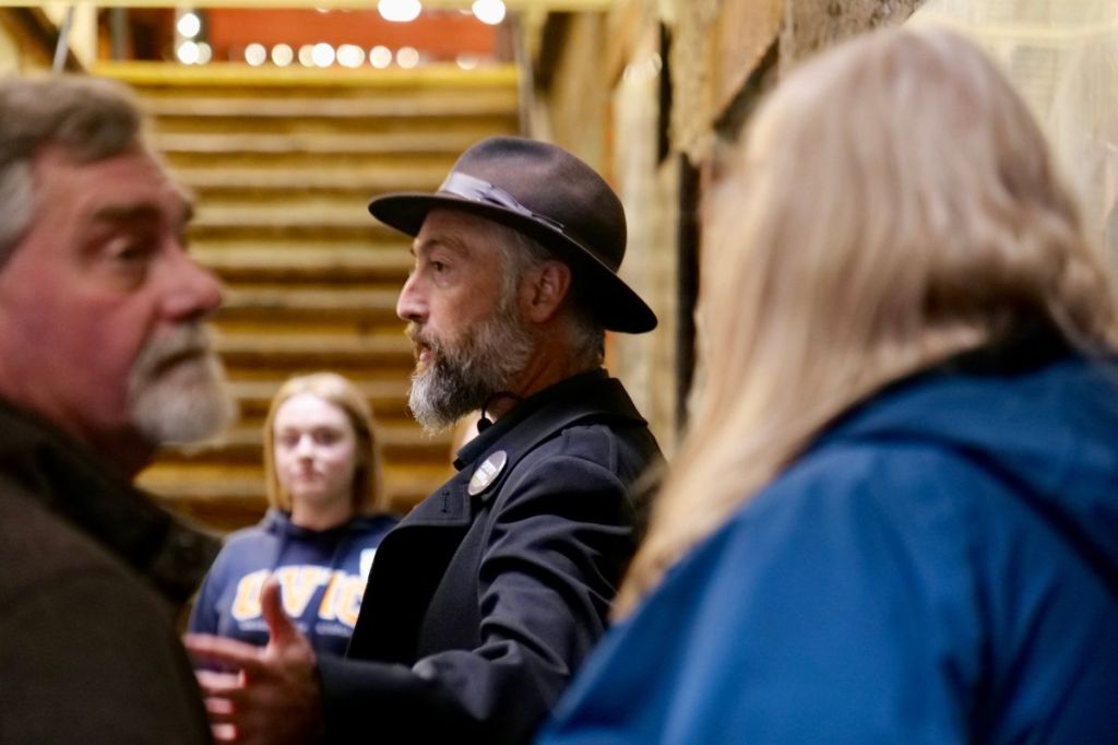 Chris Adams shares some of Victoria’s darker tales during a Ghostly Walks tour through downtown.