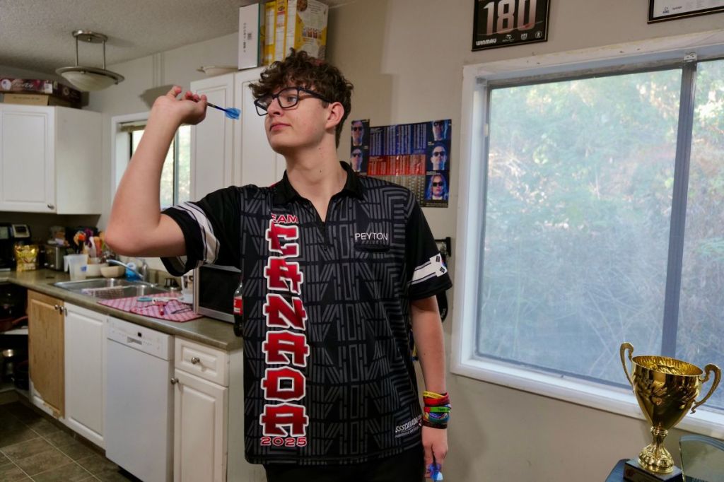 Peyton spends roughly 50 hours each week practicing his dart throwing. Tony Trozzo/Goldstream News Gazette