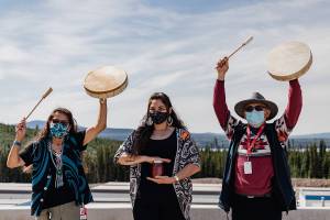 Destiney Michelle (centre), her mother, Hereditary Chief Helen Michelle (left), and fellow advisor, Pius Charlie, share their culture and traditional knowledge with workers.