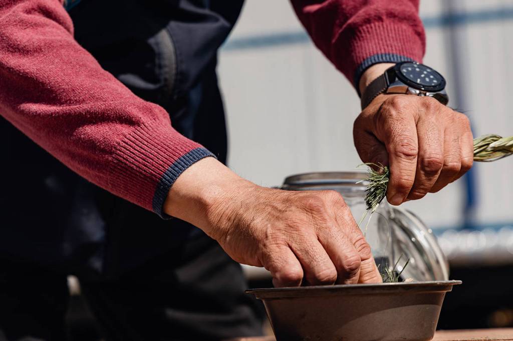 Indigenous advisors conduct cultural activities like smudging to help workers restore and reconnect, while living in lodge.