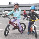 Mackenzie and Owen Sabatino take in the city’s bike rodeo Sunday, May 15. (Breelyn Grinder photo)