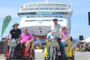 An Alaskan vote on cruise ship restrictions could spur new schedules that would benefit Victoria's economy. This file photo shows pedicabs transporting cruise ship tourists into town in July 2023. (Jake Romphf/News Staff)