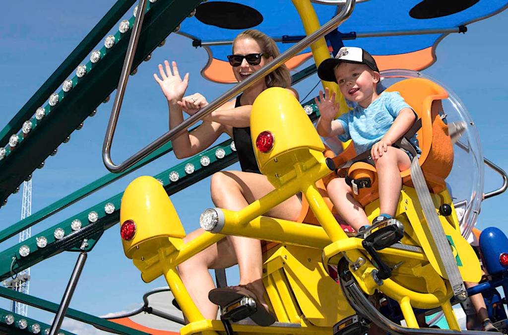Mother and child on the Flutterbye ride at the PNE fair. (File photo)