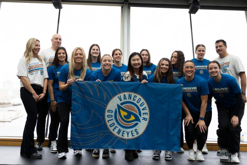 Vancouver Goldeneyes pose for a photo alongside B.C.&rsquo;s minister of sport, Anne Kang, at the team name and logo reveal event at a Cactus Club in Vancouver on Thursday, Nov. 6. (Anna Burns/Surrey Now-Leader)