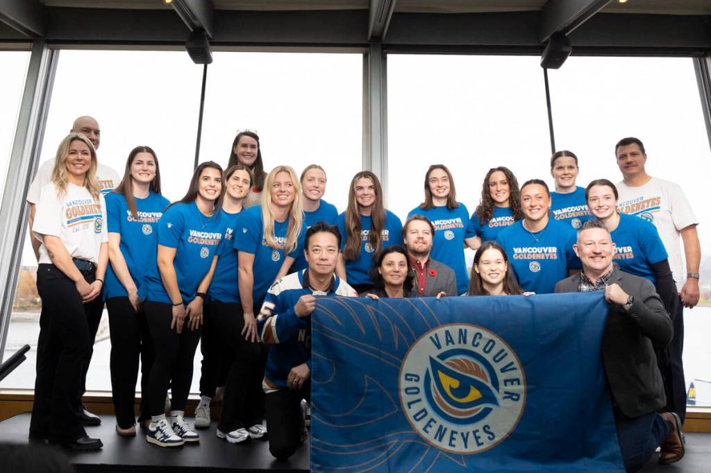 Vancouver Goldeneyes players pose for a photo alongside Vancouver mayor Ken Sim and city councillors, at the logo and team name reveal event at a Cactus Club in Vancouver on Thursday, Nov. 6. (Anna Burns/Surrey Now-Leader)