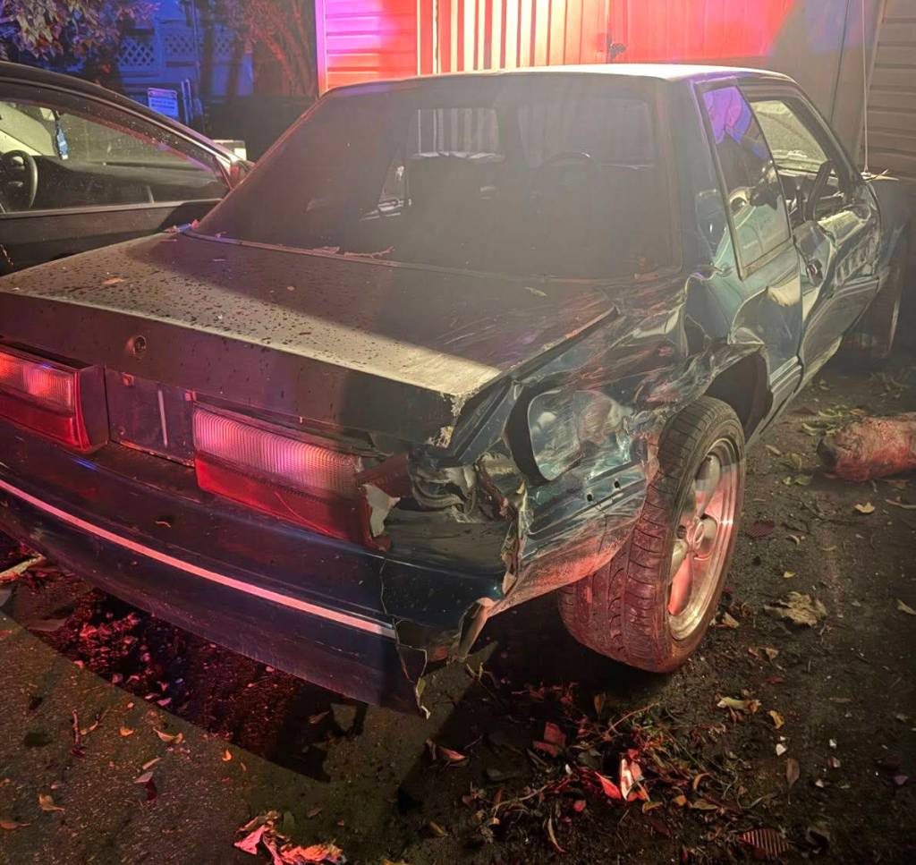A classic Mustang parked at home was damaged by the crash.