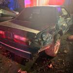 A classic Mustang parked at home was damaged by the crash.