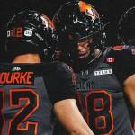 B.C. Lions quarterback Nathan Rourke celebrates a touchdown with teammate Justin McInnis during CFL action against the Ottawa Redblacks on Friday, Sept. 12, 2025 at B.C. Place.