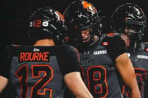 B.C. Lions quarterback Nathan Rourke celebrates a touchdown with teammate Justin McInnis during CFL action against the Ottawa Redblacks on Friday, Sept. 12, 2025 at B.C. Place.