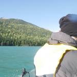 Václav Kuželka at boat&rsquo;s bow on the way across Lake Revelstoke to the Rainbow-Jordan Wilderness, pictured off to the left Oct. 9, 2025. (Evert Lindquist/Revelstoke Review)