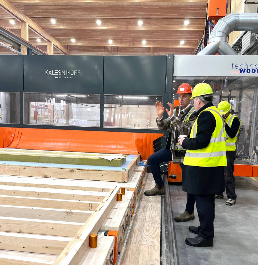 Chris Kalesnikoff (L) explains the mass timber production process to energy minister Tim Hodgson (R) on a tour of the Kalesnikoff facility on Nov. 10. (Betsy Kline/Castlegar News)