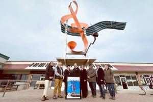 Salmon Arm Economic Development Society executive director Kate Watson, Bill Laird, Coun. Debbie Cannon, Mayor Alan Harrison, city administrator Erin Jackson and Couns. David Gonella, Kevin Flynn and Sylvia Lindgren gather at downtown&rsquo;s iconic giant treble clef to celebrate city landmark&rsquo;s recent win in this year&rsquo;s Municipal World Magazine&rsquo;s Great Canadian Landmark Contest. (Lachlan Labere-Salmon Arm Observer)