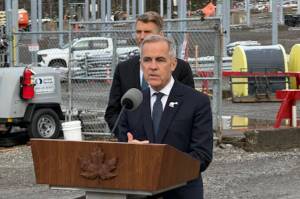 Prime Minister Mark Carney announces six new &lsquo;national-building&rsquo; projects slated for fast-tracking by the Major Projects Office at the BC Hydro Skeena Substation near Terrace on Nov. 13 as Minister of Housing and Infrastructure Gregor Robertson looks on. (Jake Wray/Black Press Media)