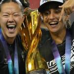 Samantha Chang, left, and Anais Oularbi pose for a photo with the Diana B. Matheson Cup at BMO Field in Toronto, Saturday (Nov. 15). (Northern Super League/ Facebook)