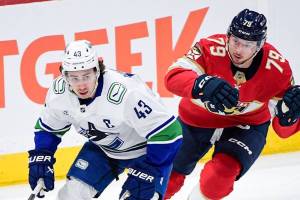 Vancouver Canucks captain Quinn Hughes, left, moved away from Florida Panthers forward Cole Schwindt during NHL action Monday, Nov. 17, 2025 at Amerant Bank Arena in Sunrise, Fla. (https://x.com/Canucks photo)