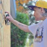 Graffiti artist Smokey Devil at work on the Brookswood memorial to Breallan Dawne Franks. Dan Ferguson/Langley Advance Tmes)