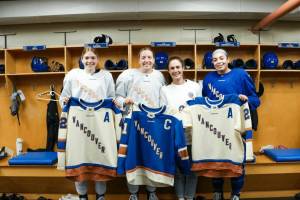 Defender Claire Thompson, left, Ashton Bell, Vancouver Rise FC first team captain Shannon Woeller, and defender and forward Sarah Nurse pose for a photo after the announcement of the Goldeneyes leadership core. (PWHL/ Vancouver Goldeneyes)