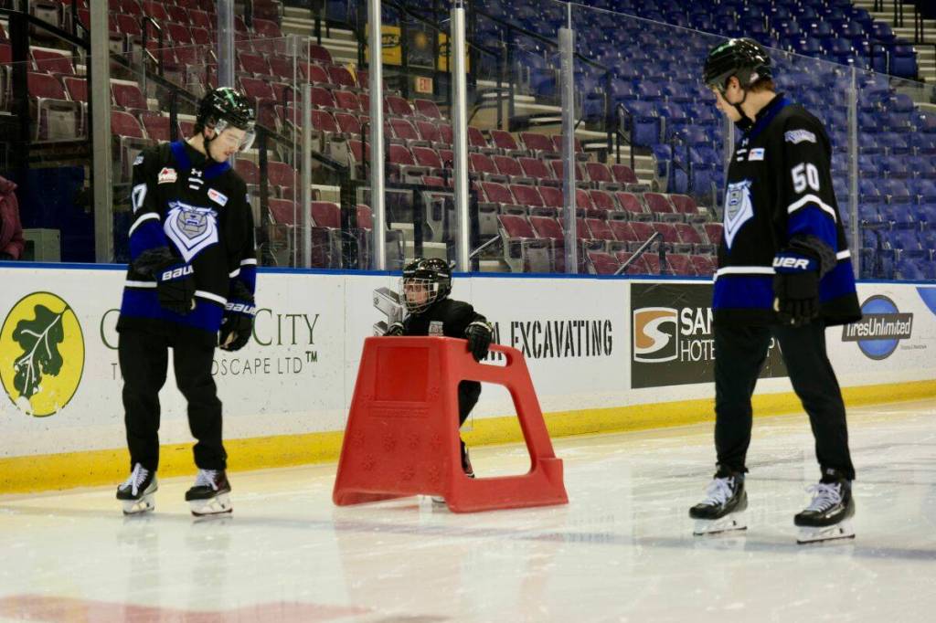Nolan Stewart (left), William Cowburn, and Ethan Eskit skate in unison down the ice during Wednesday&rsquo;s session. (Tony Trozzo/Victoria News)