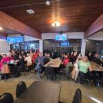 The team felt tremendous home-town support, with a group getting together to watch the final game at the Kimberley Curling Club and greeting them when they arrived at the airport. (Kimberley Curling Club/Submitted)