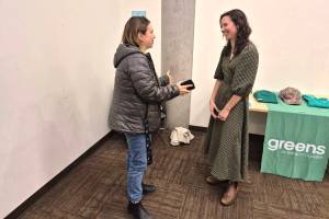 BC Green Party leader Emily Lowan (right) chats with supporter Severn Nelson during a stop in Vernon Monday, Nov. 24, at the Okanagan Regional Library. Lowan, who became party leader in September, is touring the province, chatting with people about B.C. politics and how to go about getting more Greens into the mix. (Roger Knox - Morning Star)