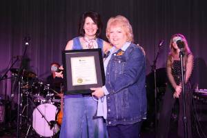 Surrey-raised musician Lisa Brokop, left, with Surrey Mayor Brenda Locke during with City of Surrey proclamation of Lisa Brokop Day during her &ldquo;Hometown Hall of Fame&rdquo; concert Monday, Nov. 24, 2025, at Shannon Hall in Cloverdale. (Contributed/Rick Chapman, City of Surrey)