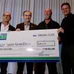 Stan Smyl (left), Darcy Rota, Gus Ascroft and Francesco Aquilini pose with the Canucks for Kids Fund&rsquo;s $10,000 cheque presented to the South Island Ravens. (Tony Trozzo/Victoria News)