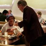 Darcy Rota walks around the restaurant, signing autographs for members of the South Island Ravens. (Tony Trozzo/Victoria News)