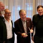 Gus Ascroft, Stan Smyl, Darcy Rota and Francesco Aquilini share a laugh during the cheque presentation on Tuesday. (Tony Trozzo/Victoria News)