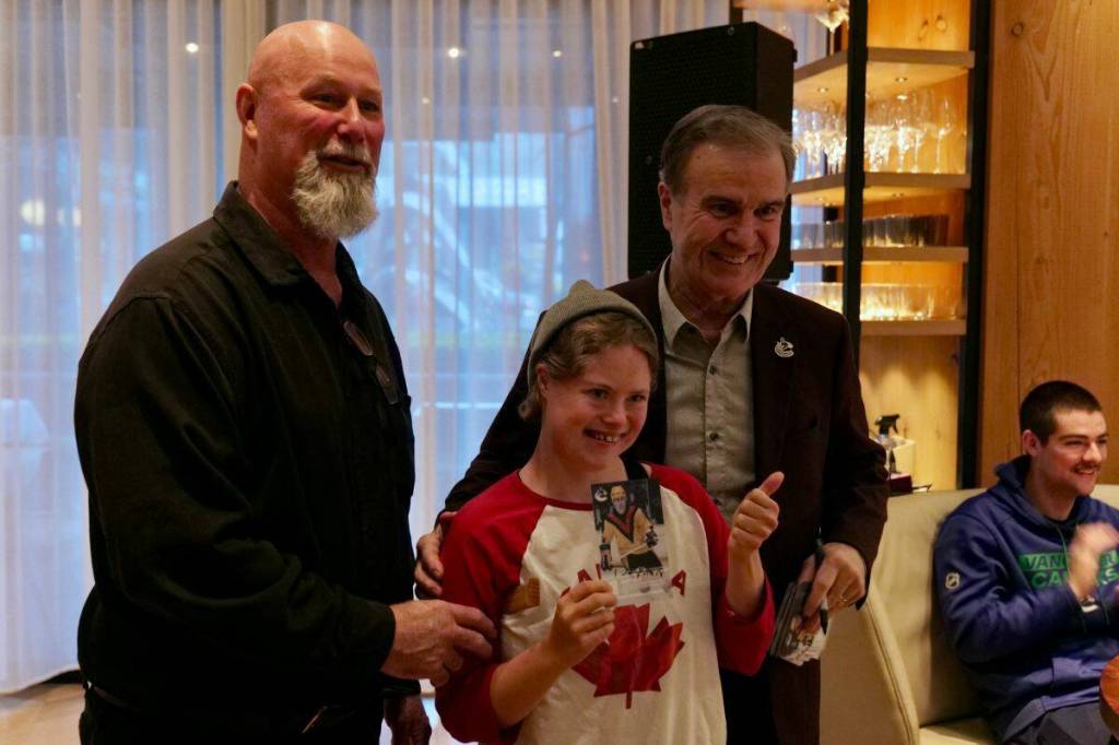 Gus Ascroft, with his daughter Georgia, and Darcy Rota pose for a picture following the cheque presentation. (Tony Trozzo/Victoria News)