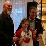 Gus Ascroft, with his daughter Georgia, and Darcy Rota pose for a picture following the cheque presentation. (Tony Trozzo/Victoria News)