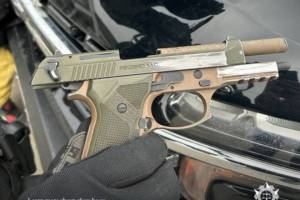 Christopher Fillingham, 48, of Valemount, was found to have this semi-automatic pistol as well as ammunition, cash and illicit drugs in his possession in a March 2024 traffic stop. (Combined Forces Special Enforcement Unit of B.C. photo)