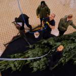 Surjit Dhanota and his crew are preparing to erect the tree. (Olivier Laurin/Victoria News)