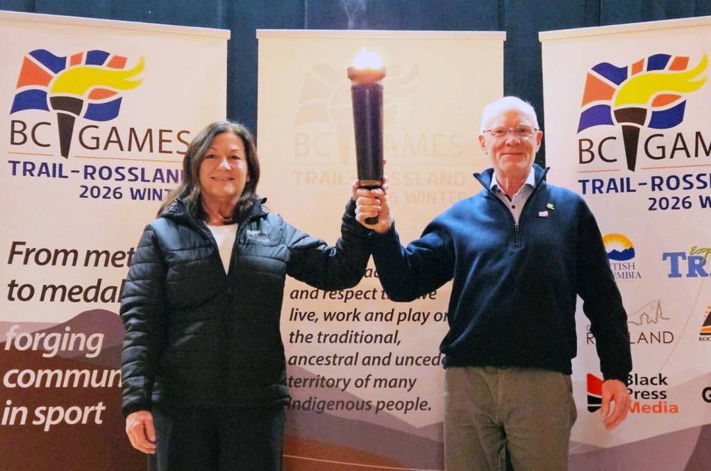 Trail Mayor Colleen Jones and Rossland Mayor Andy Morel share in the excitement of counting down to the 2026 BC Winter Games at the torchlighting event in the Trail Memorial Centre. (Jim Bailey/Trail Times)