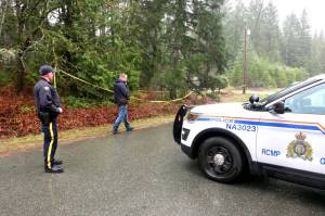 Nanaimo RCMP constables Adam Taylor, left, and Josh Waltman on scene near a plane crash close to Twilight Way south of Nanaimo on Thursday, Nov. 27. (Chris Bush/News Bulletin)